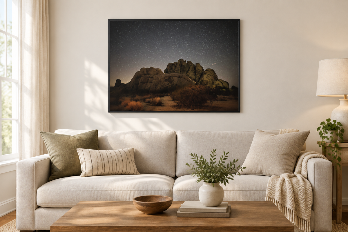 Joshua Tree Night Sky Shooting Star photograph framed above a neutral living room sofa