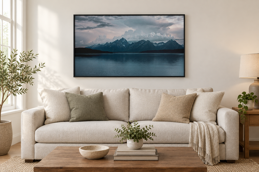 Jackson Lake photograph framed above a neutral living room sofa