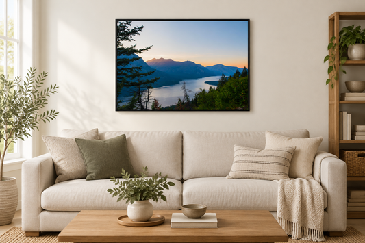 Waterton Lake Glacier National photograph framed above a neutral living room sofa