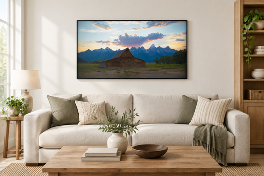 Tetons T.A Moulton Barn photograph framed above a neutral living room sofa